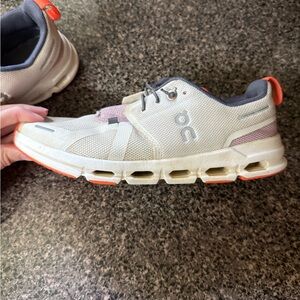 On Running Cream and Orange Athletic Shoes
